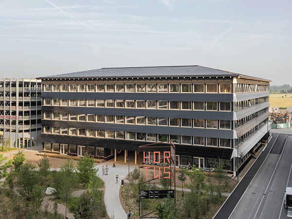The five-storey, HORTUS building in Basil, Switzerland will provide about 600 workspaces using locally-sourced modular timber frame and compressed clay from the site itself.