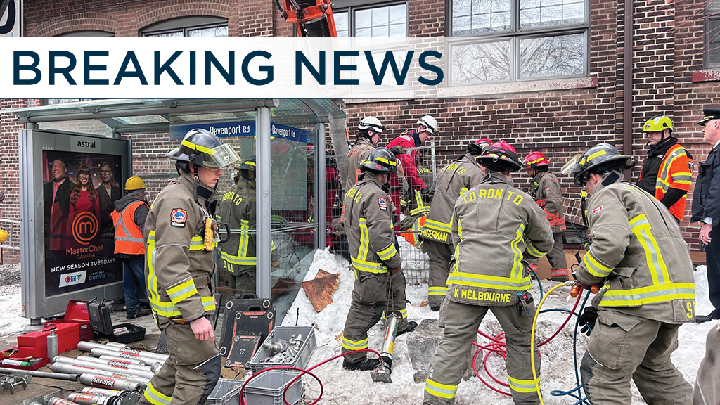 THE LATEST: After more than 4 hours, crews free worker pinned under concrete