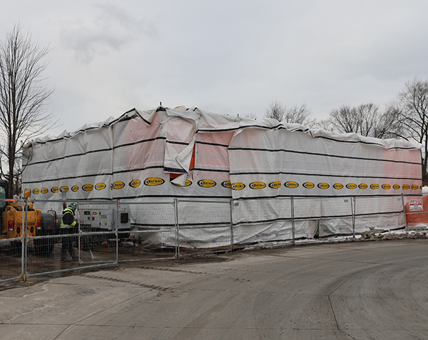 This photo shows new crew rest building under wraps during winter construction at Windsor's west end bus terminal.