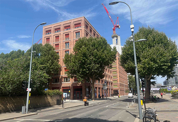MacFarlane Place in Hammersmith, U.K. has electrically-controlled window shutters to help mitigate solar heat gain in the building’s interior.
