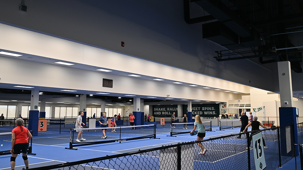 The half dozen pro courts have ceiling heights of 20 feet, while areas with lower ceilings are used for lessons and corporate events. Four pro courts are in a former corridor, with one of the mall’s domed skylights above.