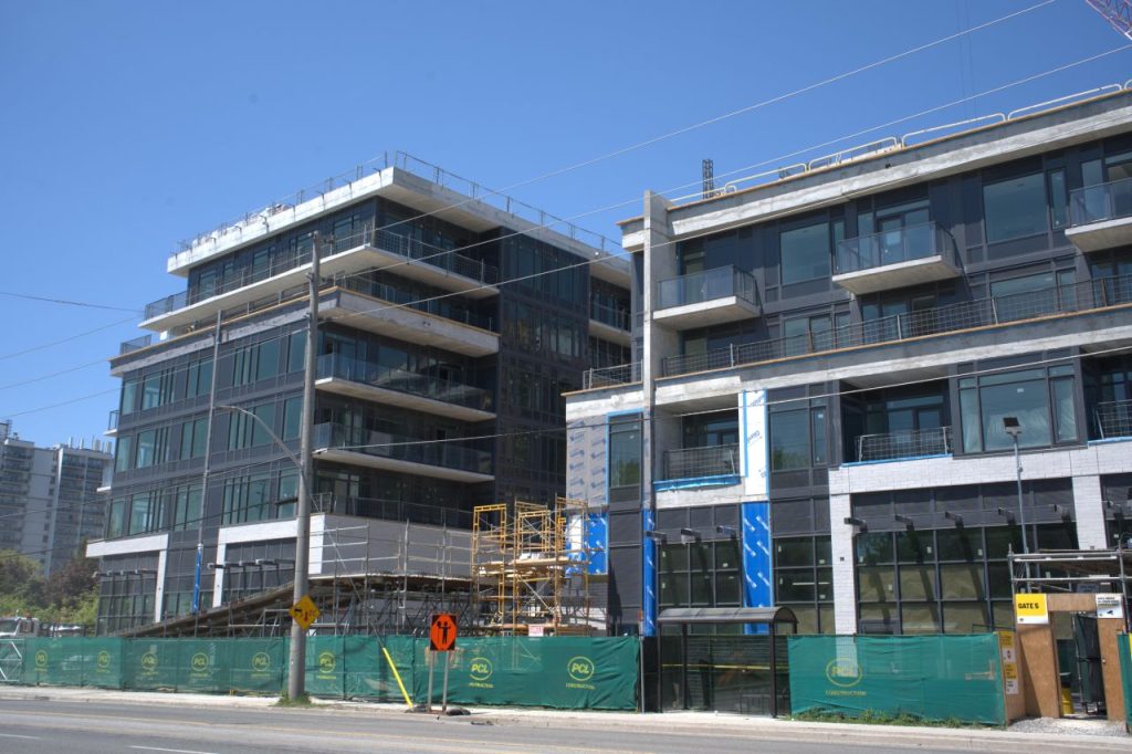 PCL Construction tops off Lakeview DXE Club condo development