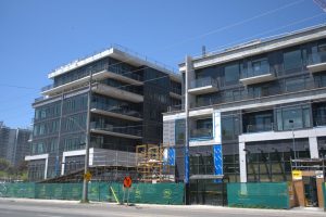 PCL Construction tops off Lakeview DXE Club condo development