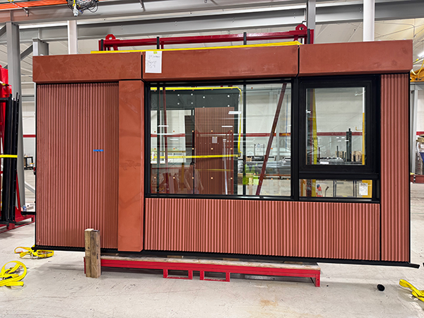 Prefabricated exterior retrofit panel in a factory before shipping