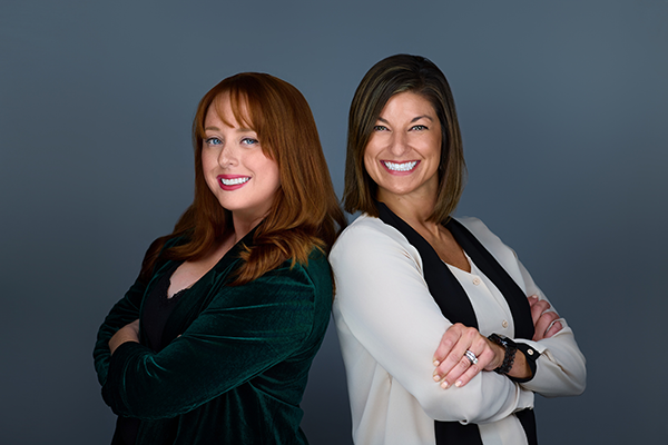 Sam Roman, president and CEO, ABC-NJ (left) stands back-to-back with Amanda Milewski, executive vice-president.