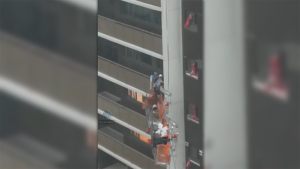 VIDEO: Platform holding workers swings uncontrollably as wicked storm rips through Toronto